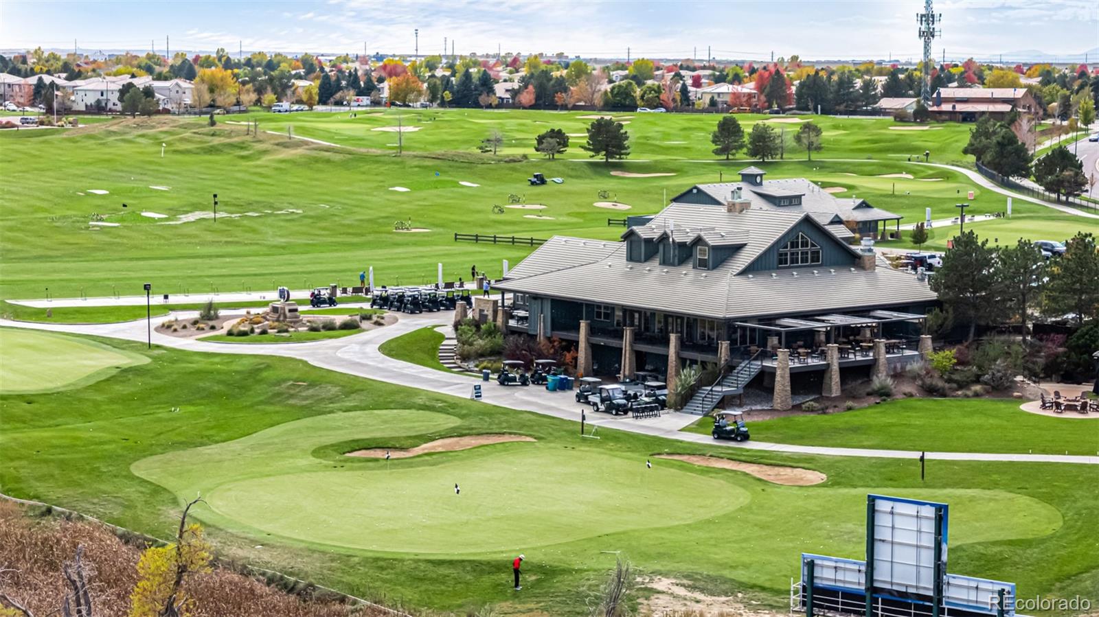 21300 East 42nd Avenue Denver, CO 80249 - Photo 6 of 48 a view of a big house with big yard and large trees