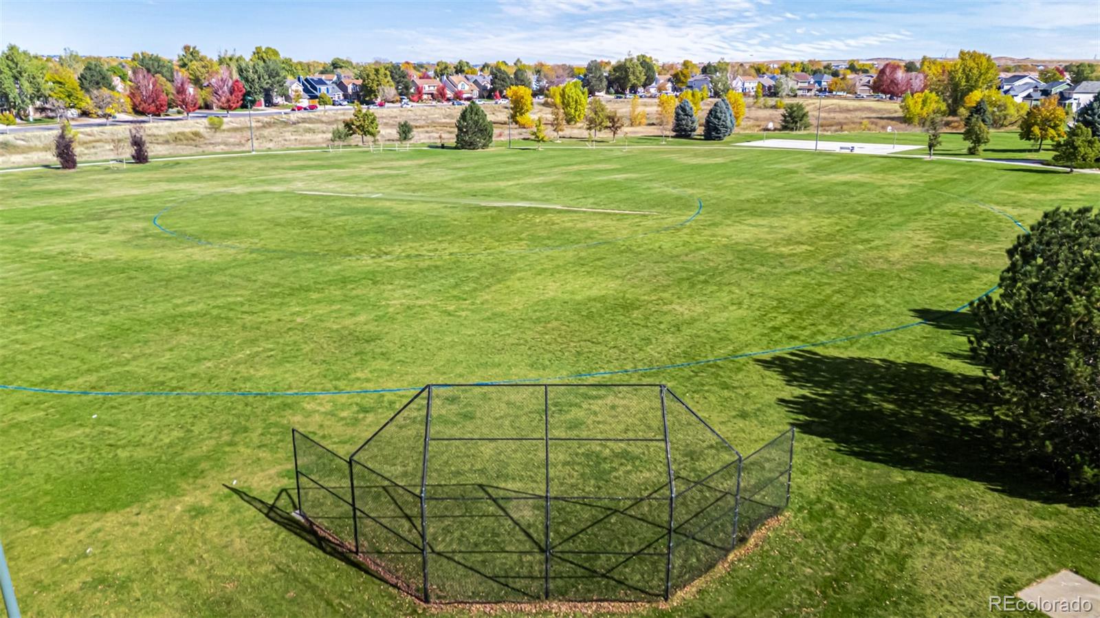 21300 East 42nd Avenue Denver, CO 80249 - Photo 8 of 48 a view of a big yard with an outdoor space