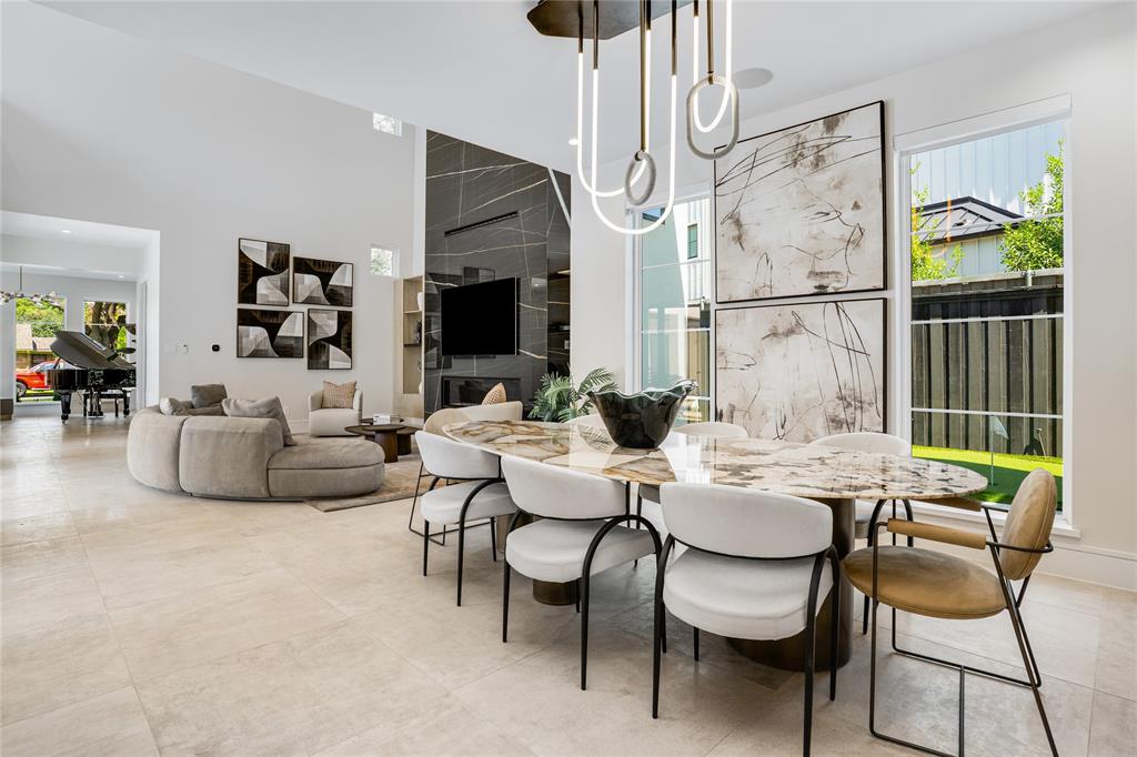 5510 Caladium Drive Dallas, TX 75230 - Photo 11 of 40 a view of a dining room with furniture a livingroom and chandelier