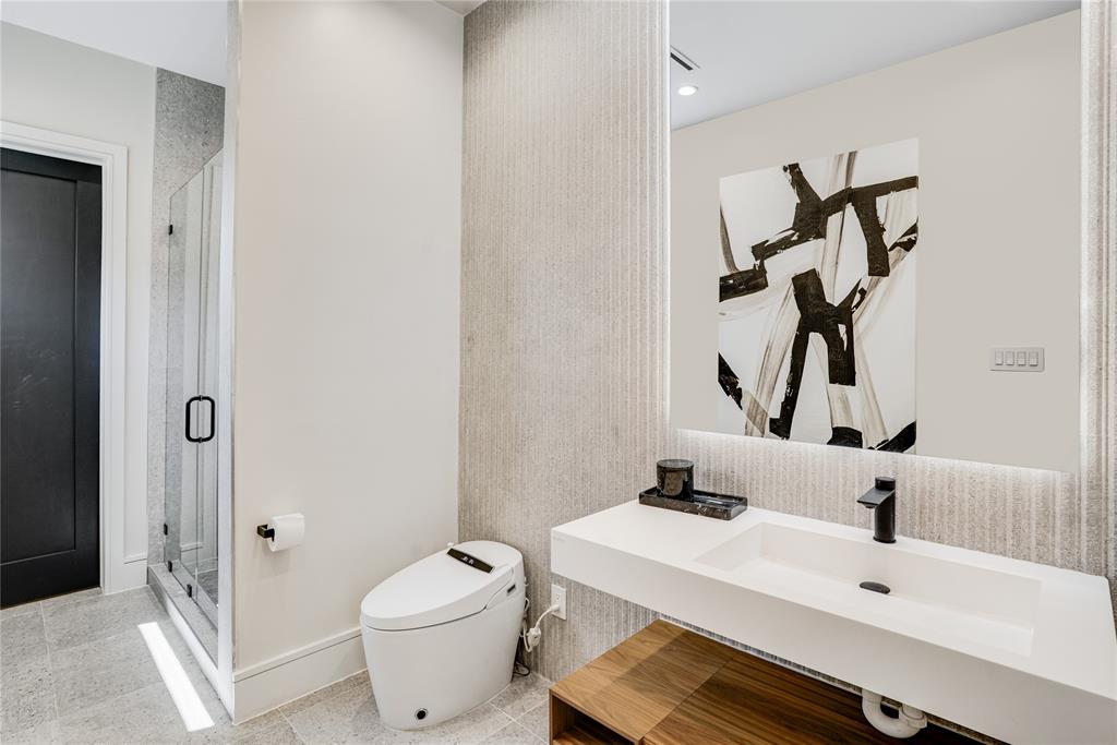 5510 Caladium Drive Dallas, TX 75230 - Photo 21 of 40 a bathroom with a sink a toilet and shower