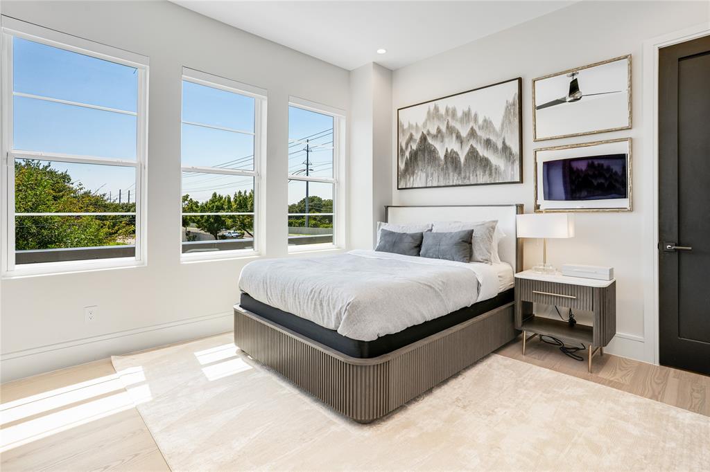 5510 Caladium Drive Dallas, TX 75230 - Photo 30 of 40 a bedroom with a large bed and a window