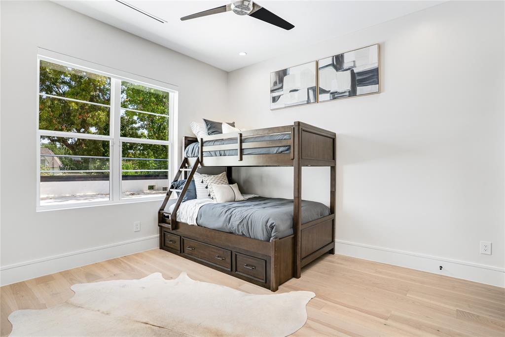 5510 Caladium Drive Dallas, TX 75230 - Photo 31 of 40 a bedroom with a bed and window