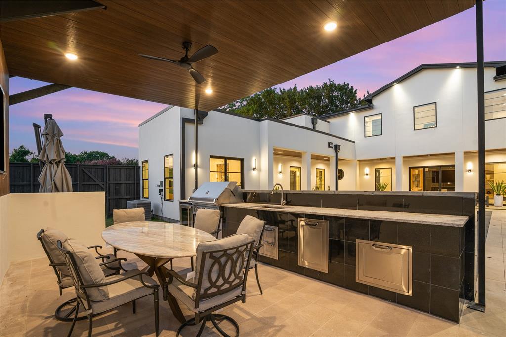 5510 Caladium Drive Dallas, TX 75230 - Photo 37 of 40 a dining area with a table and chairs