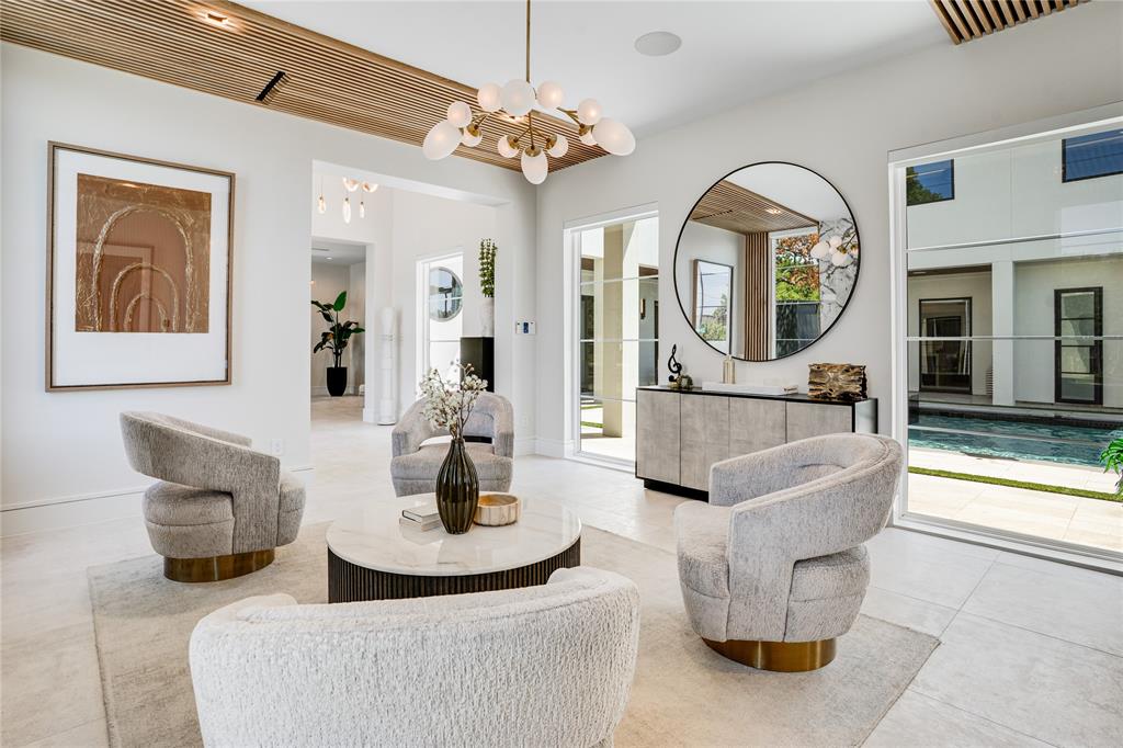 5510 Caladium Drive Dallas, TX 75230 - Photo 5 of 40 a living room with fireplace furniture and a large window