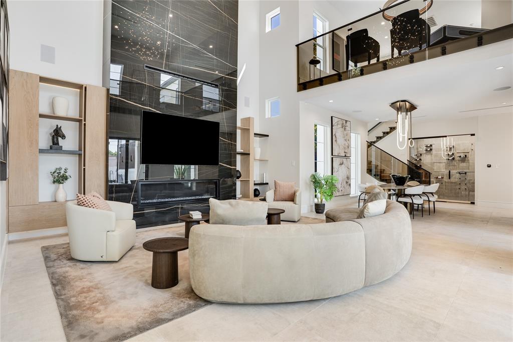 5510 Caladium Drive Dallas, TX 75230 - Photo 9 of 40 a living room with furniture and a flat screen tv