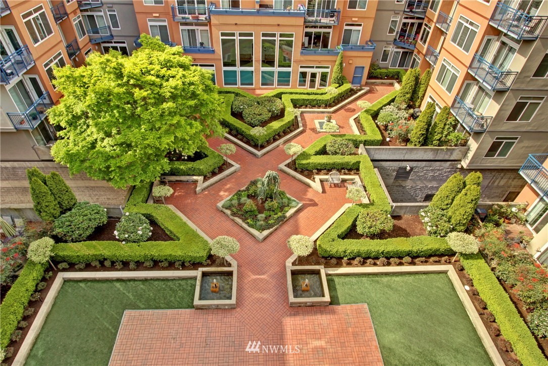 2415 2nd Avenue, Unit 547 Seattle, WA 98121 - Photo 3 of 20 an aerial view of a house with a garden and swimming pool