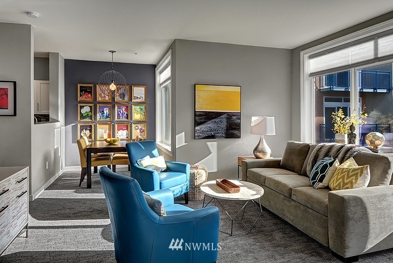 2415 2nd Avenue, Unit 547 Seattle, WA 98121 - Photo 4 of 20 a living room with furniture a rug and a window