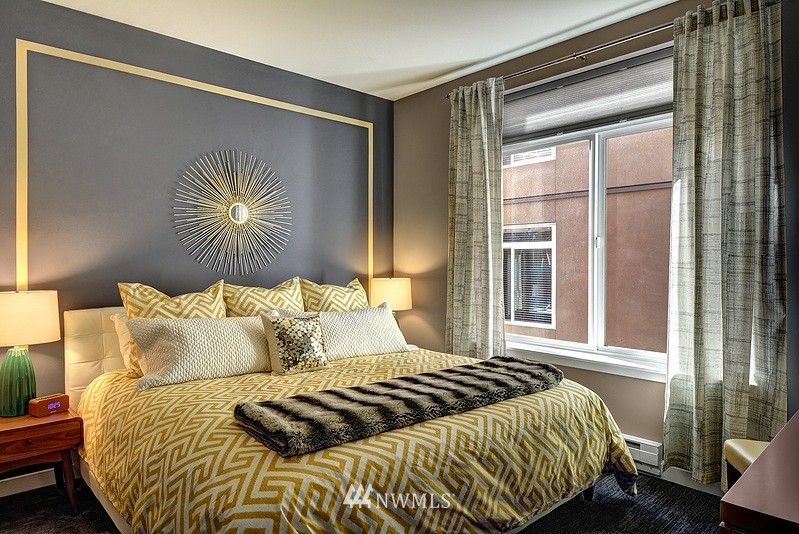 2415 2nd Avenue, Unit 547 Seattle, WA 98121 - Photo 10 of 20 a bedroom with a bed and a window