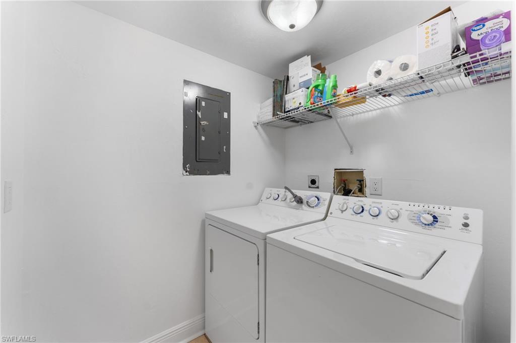 14053 Northumberland Drive Southwest, Unit 105 Fort Myers, FL 33908 - Photo 25 of 38 a utility room with dryer and washer