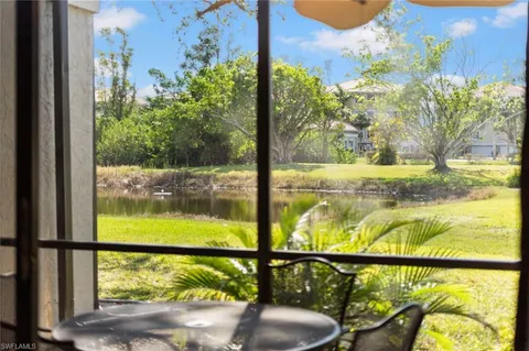 a view of a porch with furniture and garden