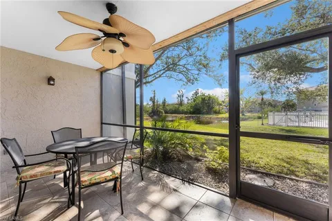 a view of a dining room with furniture large window and outside view