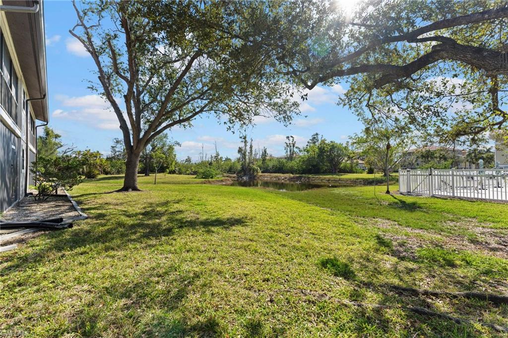 14053 Northumberland Drive Southwest, Unit 105 Fort Myers, FL 33908 - Photo 31 of 38 a view of a park with large trees