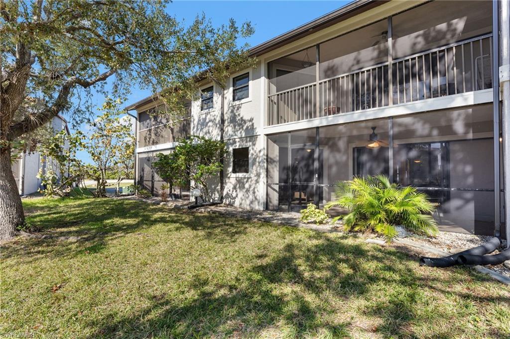 14053 Northumberland Drive Southwest, Unit 105 Fort Myers, FL 33908 - Photo 33 of 38 a view of a house with a yard and sitting area