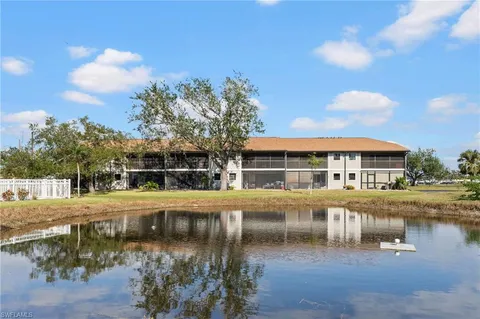 a view of a swimming pool with a table and chairs
