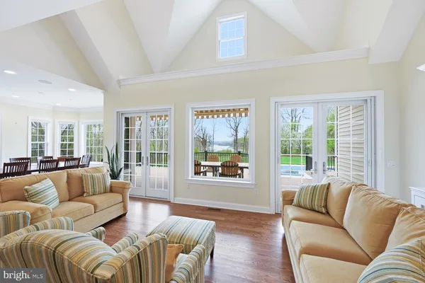 a kitchen with stainless steel appliances granite countertop a sink a stove and refrigerator