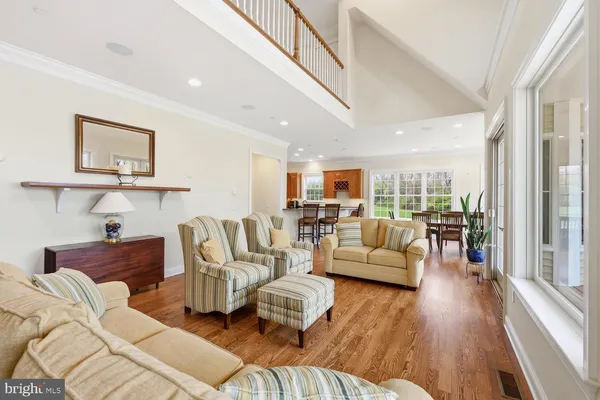 a kitchen with stainless steel appliances granite countertop a sink and a large window