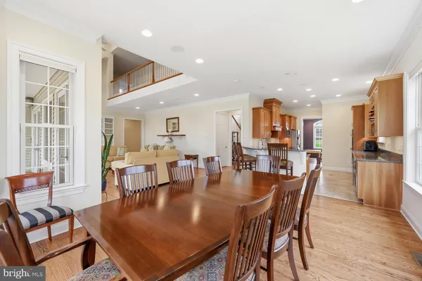 a view of a livingroom with furniture a flat screen tv and floor to ceiling window