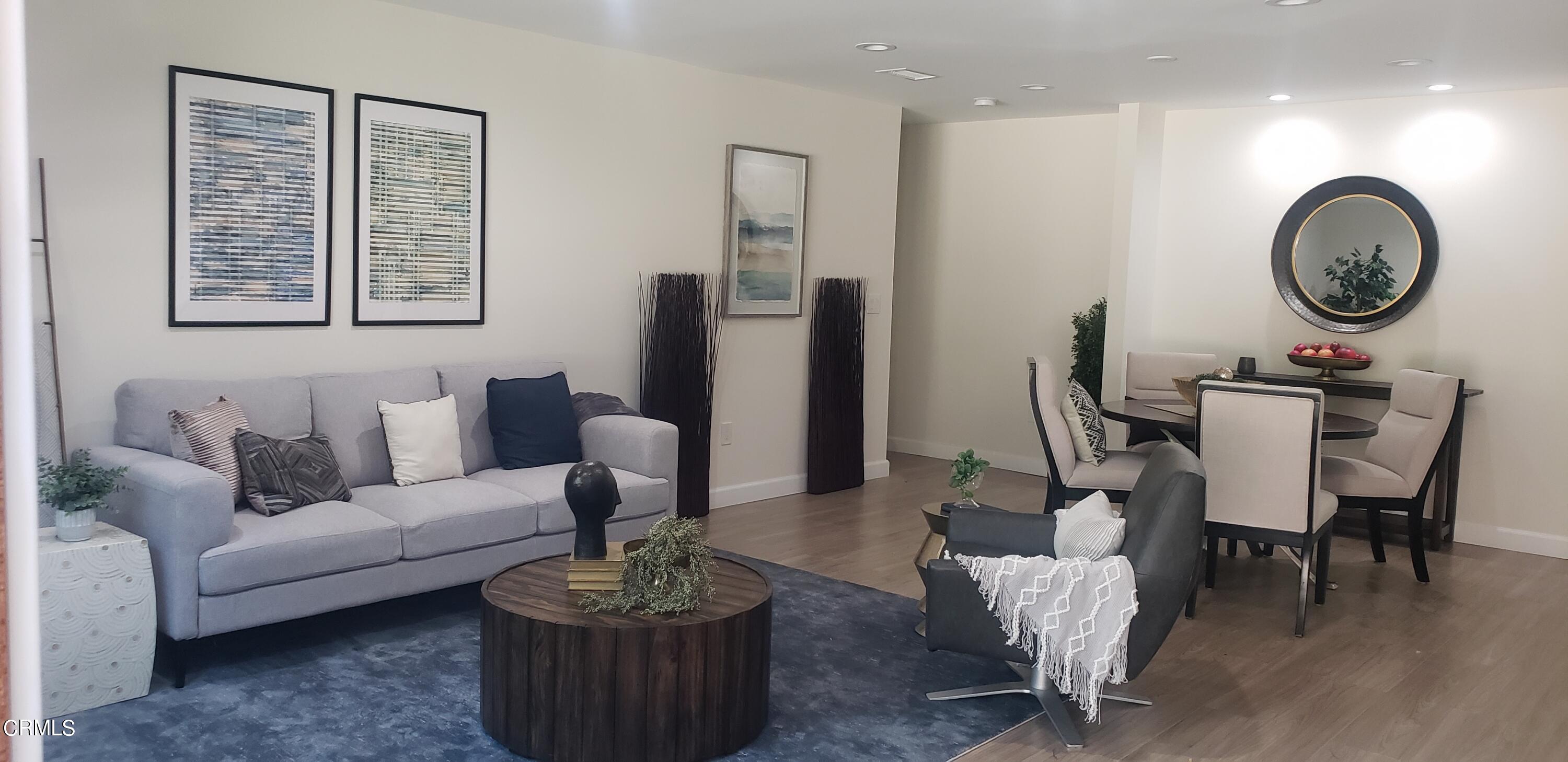 254 Marathon Road Altadena, CA 91001 - Photo 1 of 2 a living room with furniture a clock and a window
