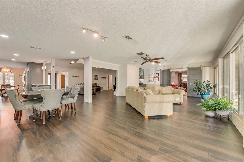 805 Crowley Road Arlington, TX 76012 - Photo 12 of 26 a living room with furniture or wooden floor and a rug