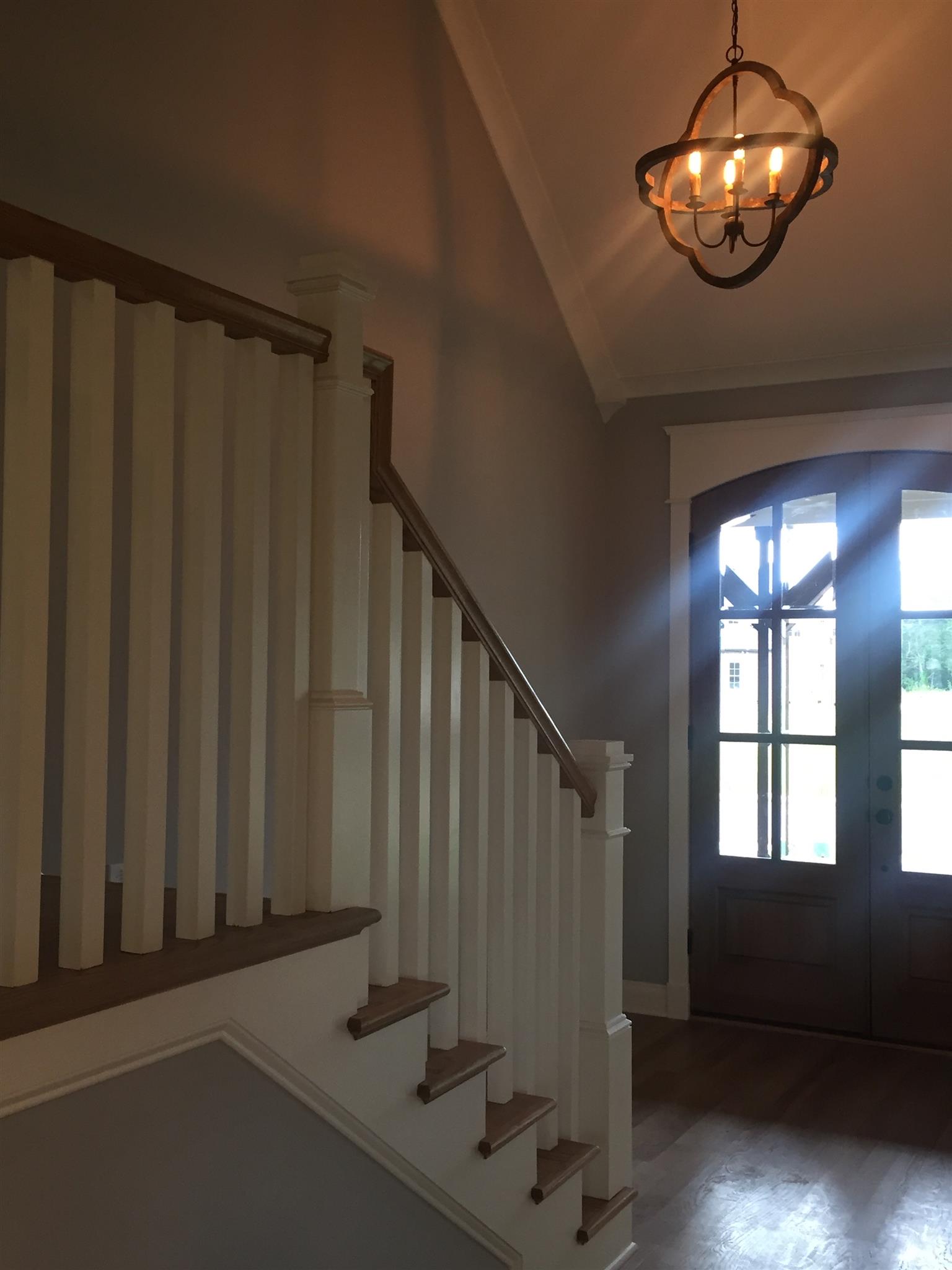 2618 Ritz Lane Murfreesboro, TN 37130 - Photo 3 of 10 a view of staircase with railing and a chandelier