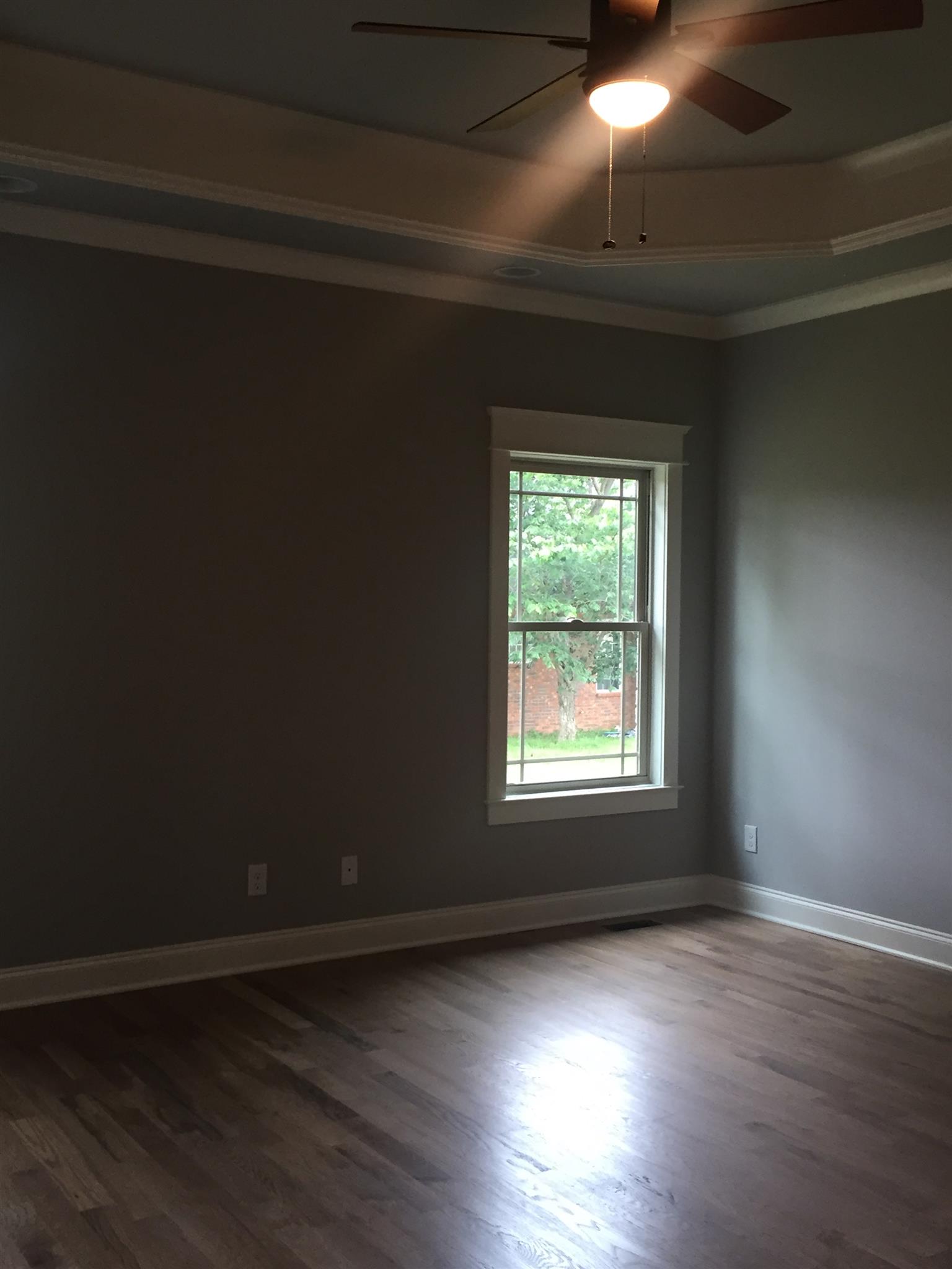 2618 Ritz Lane Murfreesboro, TN 37130 - Photo 9 of 10 a view of an empty room with wooden floor and a window