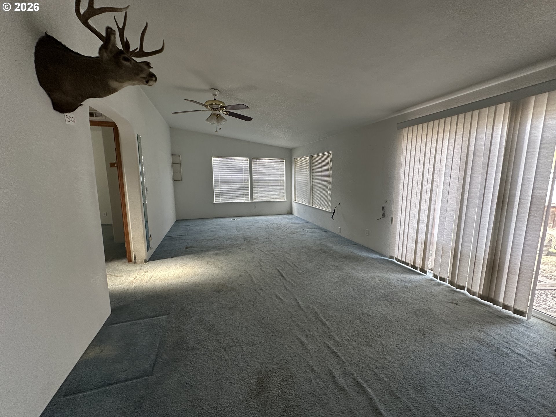 404 West 2nd Street Fossil, OR 97830 - Photo 11 of 19 wooden floor in an empty room with a window