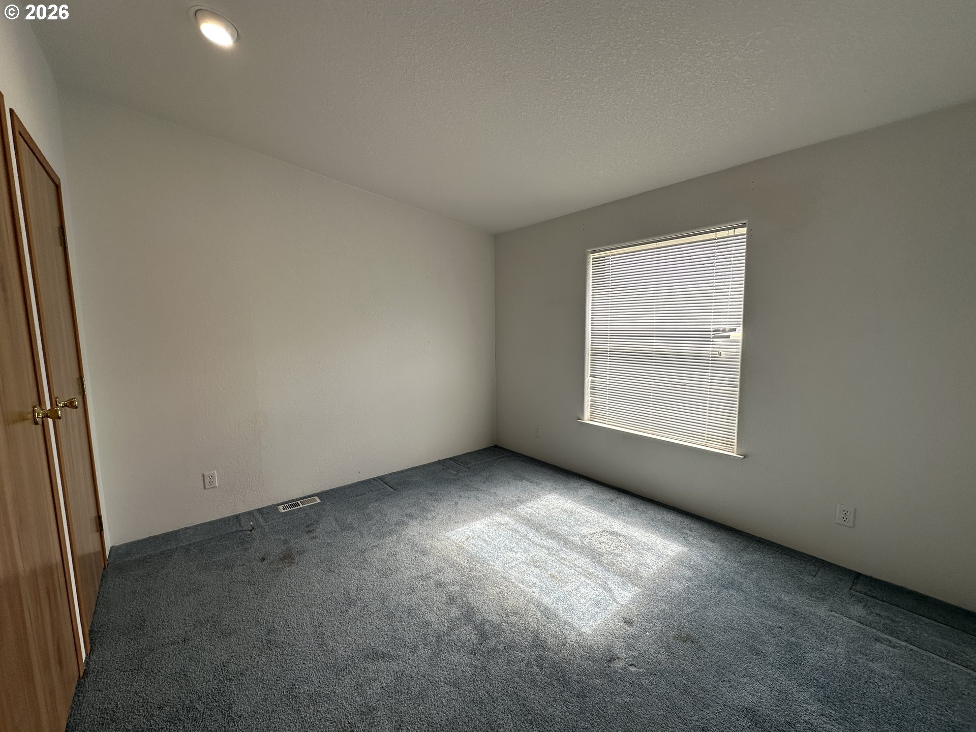 404 West 2nd Street Fossil, OR 97830 - Photo 13 of 19 an empty room with windows