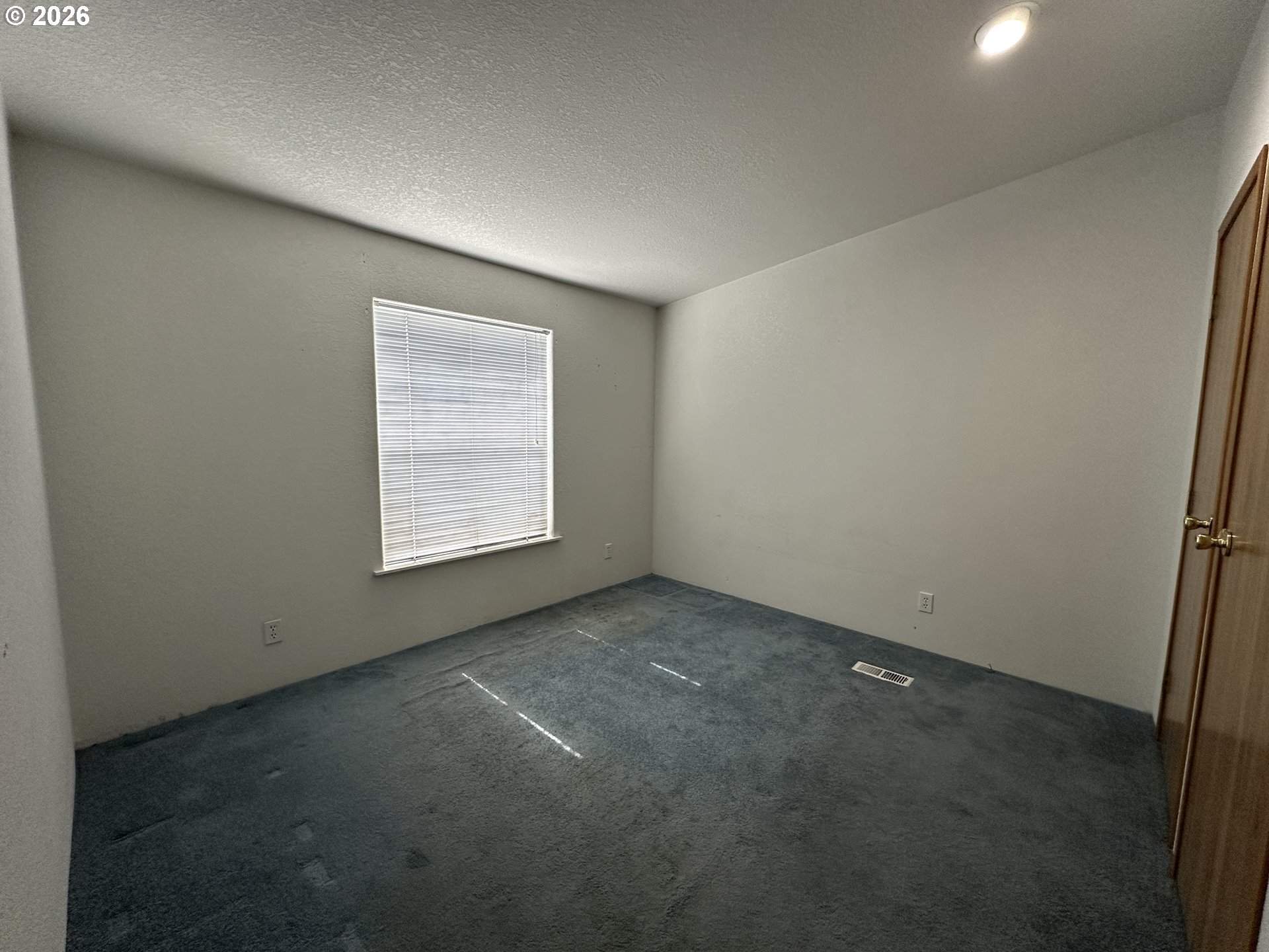 404 West 2nd Street Fossil, OR 97830 - Photo 15 of 19 an empty room with windows