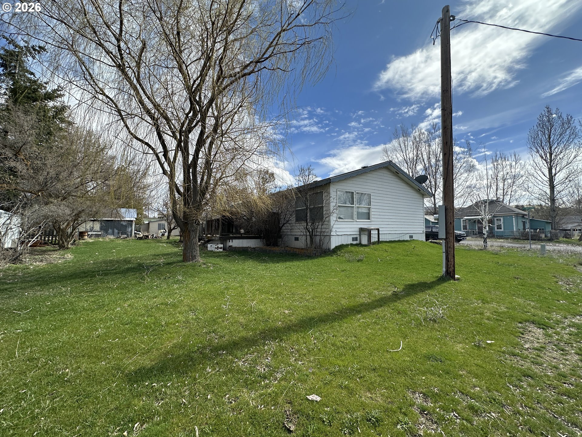 404 West 2nd Street Fossil, OR 97830 - Photo 3 of 19 a view of a house with backyard and a tree