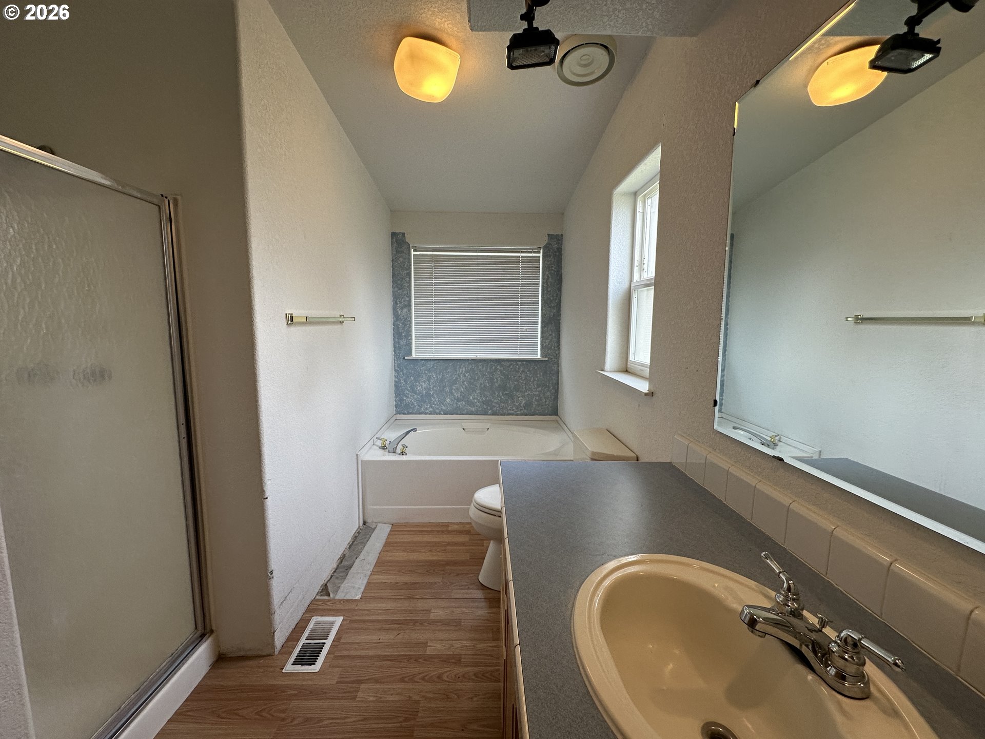 404 West 2nd Street Fossil, OR 97830 - Photo 6 of 19 a bathroom with a granite countertop sink and a mirror