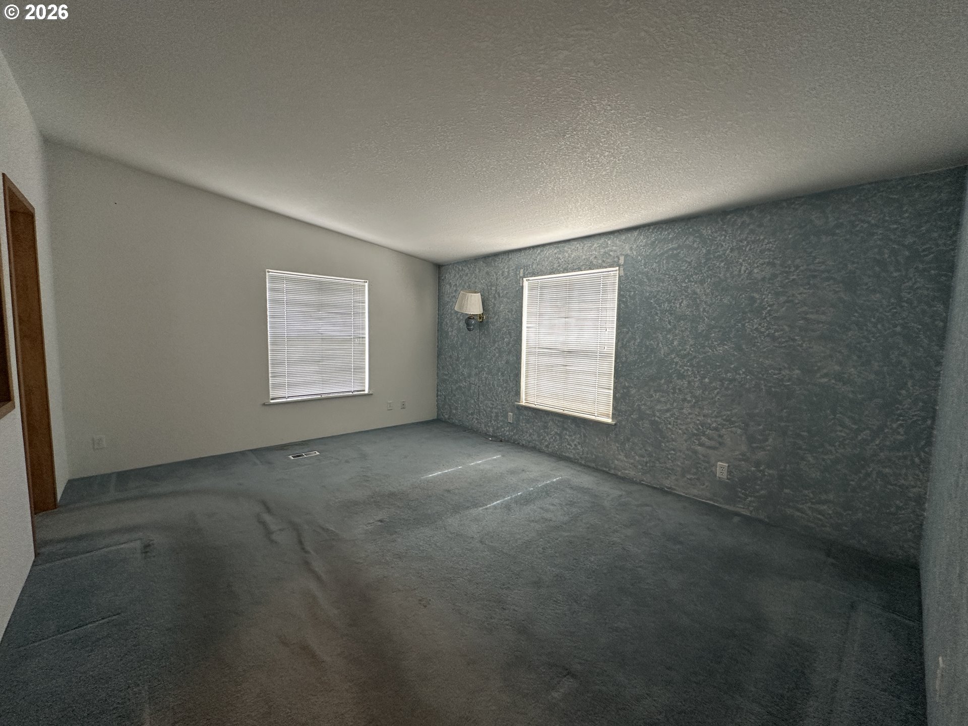 404 West 2nd Street Fossil, OR 97830 - Photo 8 of 19 an empty room with windows