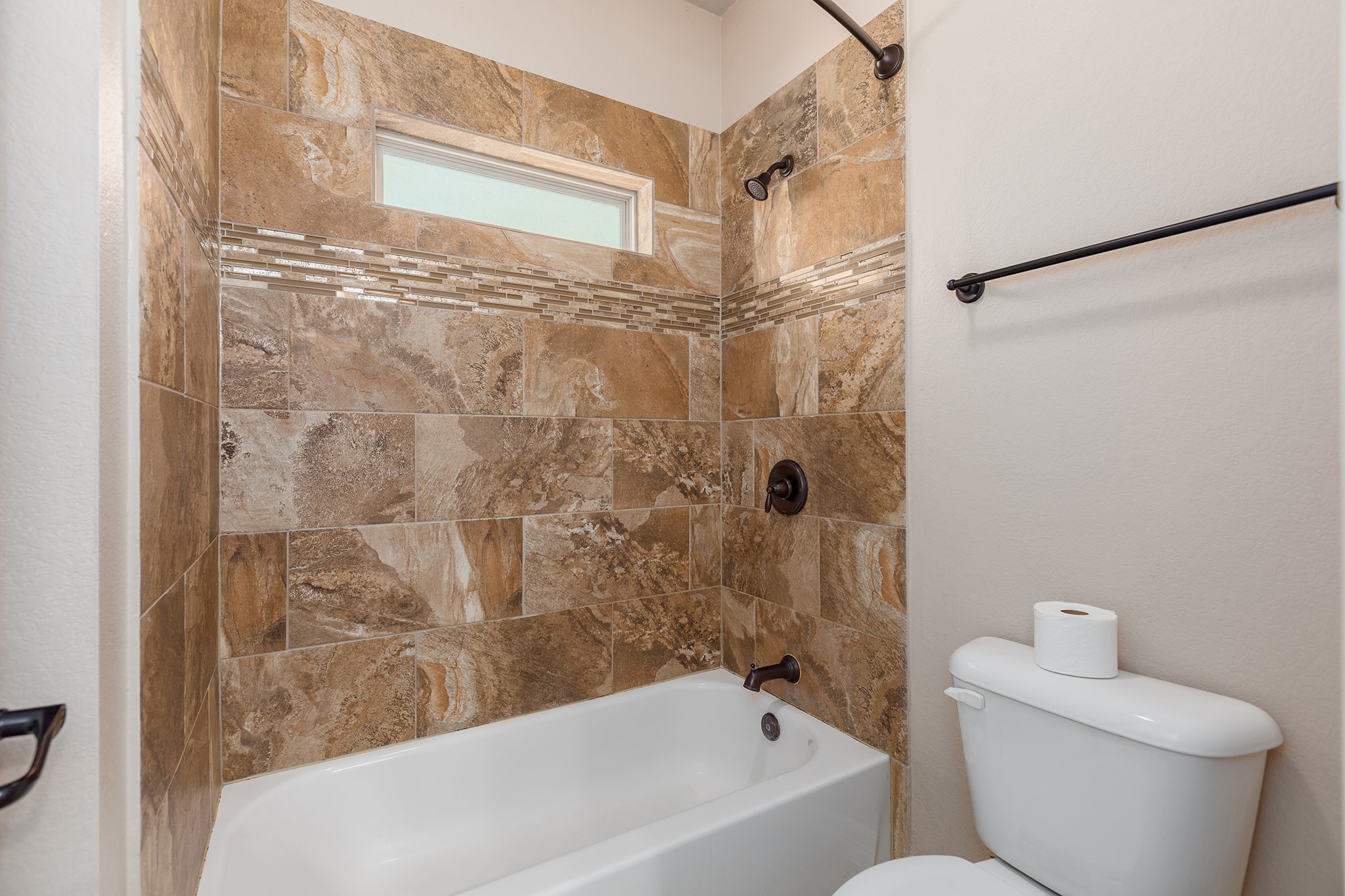 27688 Rio Blanco Drive Splendora, TX 77372 - Photo 29 of 50 a bathroom with a toilet and a bathtub