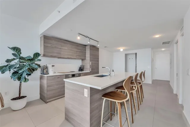 a bathroom with a shower and a sink