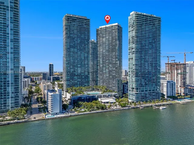 a view of a balcony with table and chairs