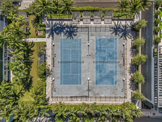 a patio with a patio table and chairs