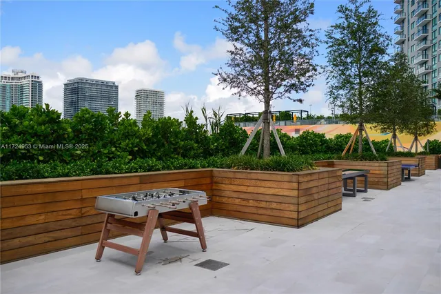 a room with furniture and view kitchen