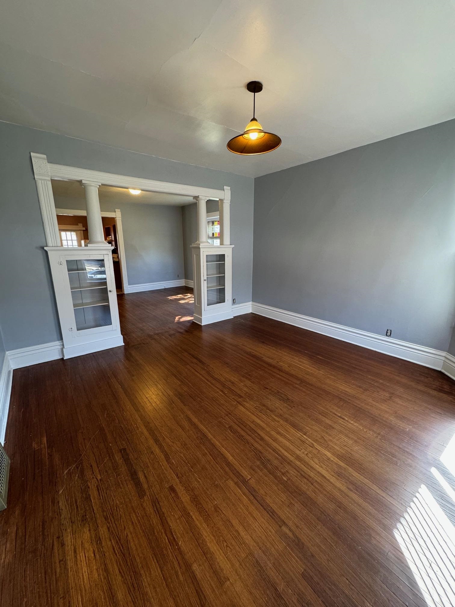 124 South Prospect Street Rockford, IL 61104 - Photo 3 of 13 a view of a room with wooden floor and staircase