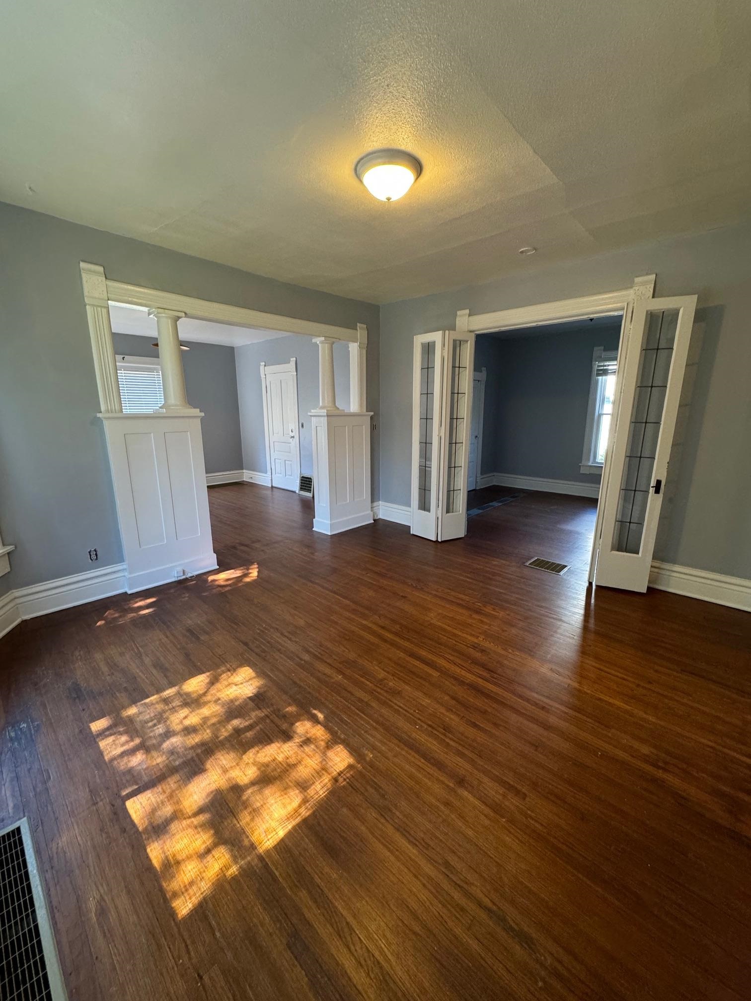124 South Prospect Street Rockford, IL 61104 - Photo 6 of 13 an empty room with wooden floor and window