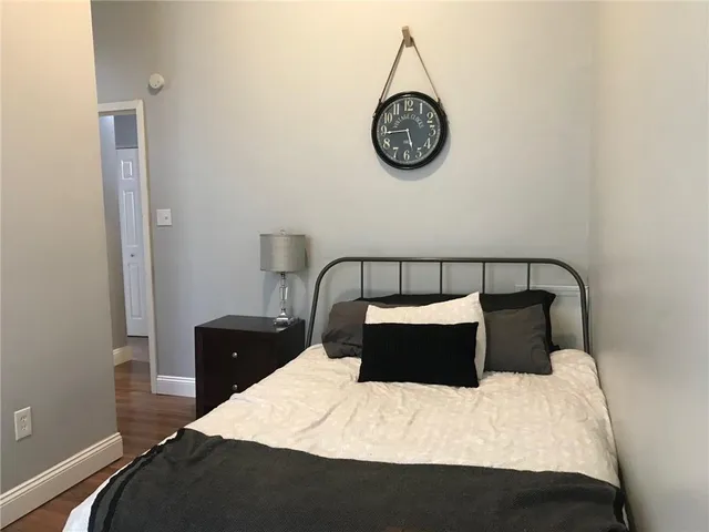 a bedroom with a bed and a table