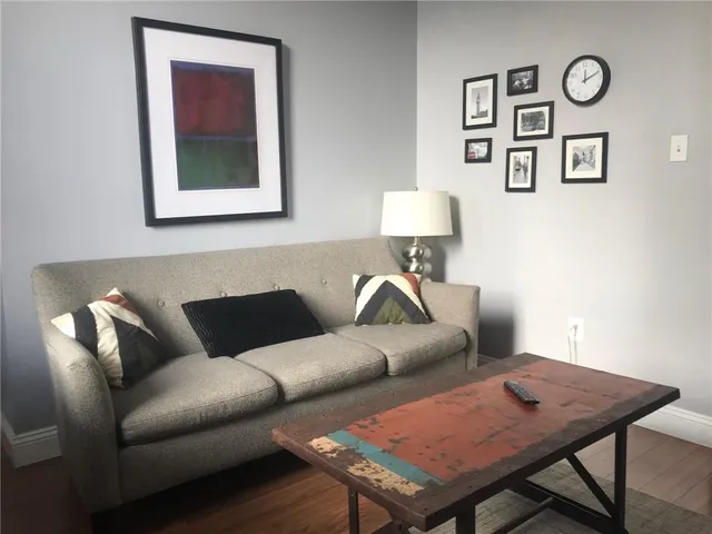 a living room with furniture and a rug