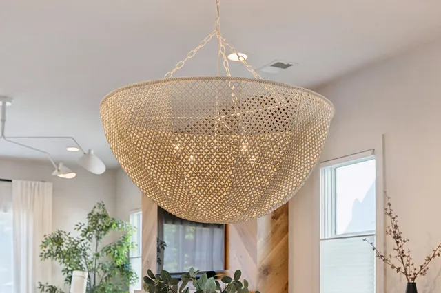 a kitchen with a sink stove and wooden floor