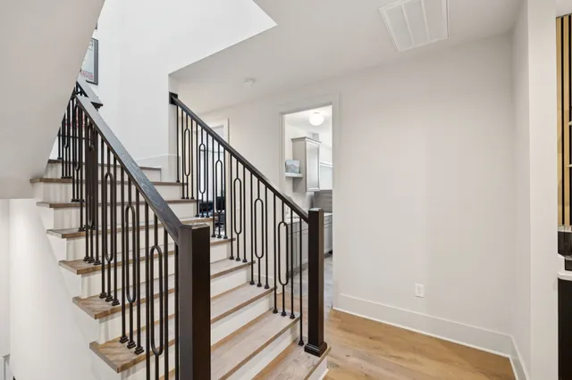 a large bedroom with a bed and a window
