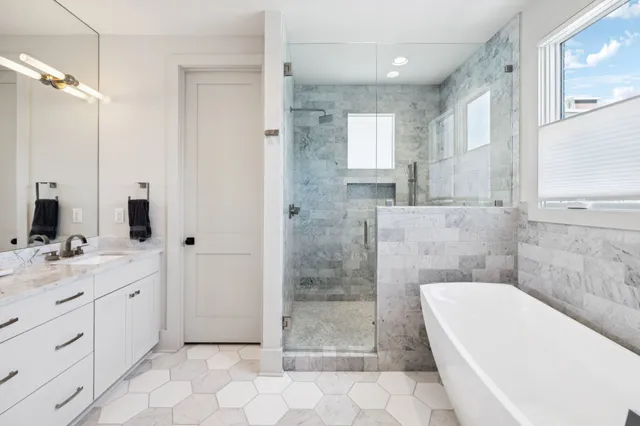 a bathroom with double sink and a mirror