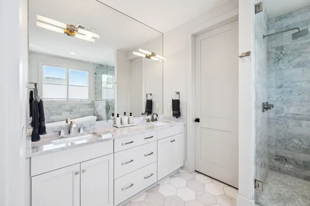 a bathroom with a bathtub and shower