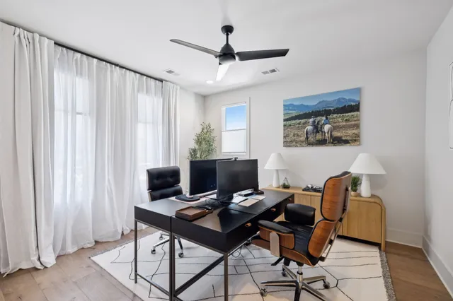 a bathroom with a sink vanity granite shower and a mirror
