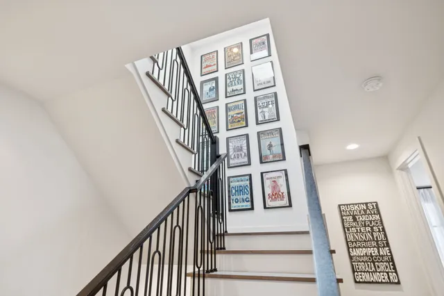 a bedroom with a bed and a potted plant