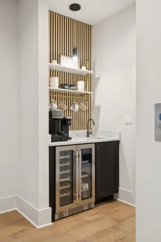 a kitchen with a sink a stove and a microwave