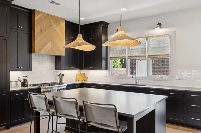 a kitchen with a table and a stove