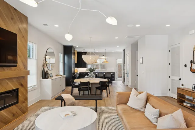a living room with fireplace furniture and a flat screen tv