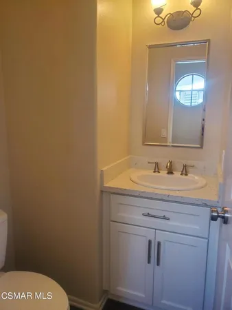 a bathroom with a sink and a toilet